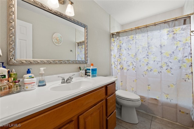 bathroom with tile patterned floors, vanity, and toilet