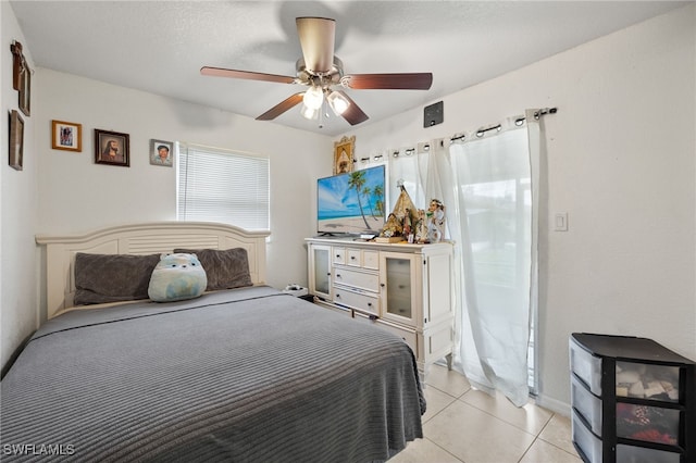 bedroom featuring ceiling fan and light tile patterned floors