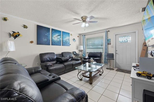 tiled living room featuring ceiling fan and a textured ceiling