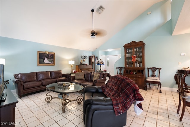 tiled living room with ceiling fan and lofted ceiling