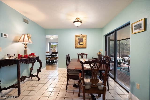 dining space featuring light tile patterned floors