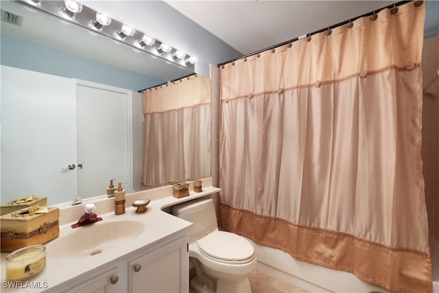 full bathroom featuring vanity, toilet, and shower / bathtub combination with curtain