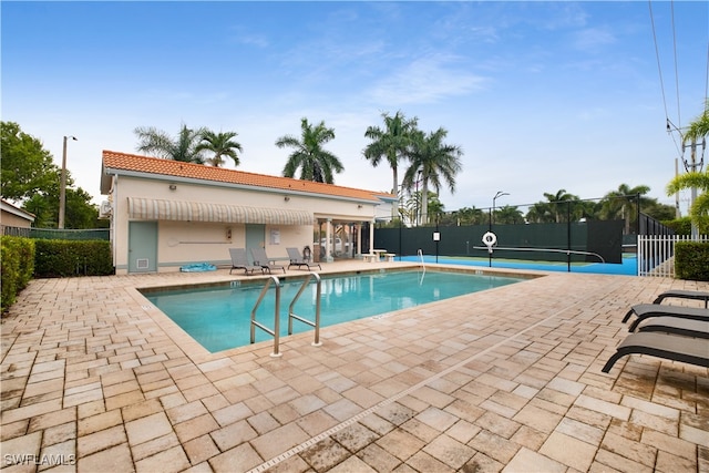 view of swimming pool with a patio