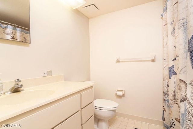 bathroom featuring a shower with shower curtain, tile patterned flooring, vanity, and toilet