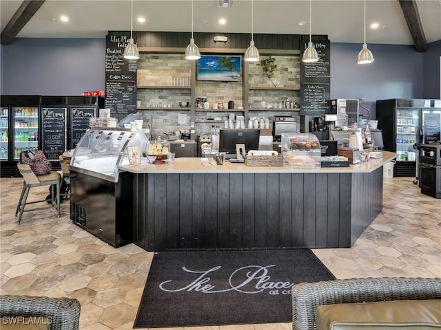 bar featuring beam ceiling and pendant lighting