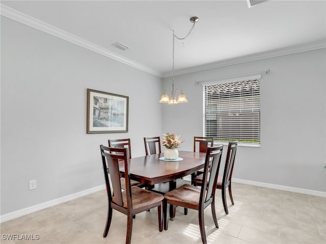 dining area featuring ornamental molding and a notable chandelier