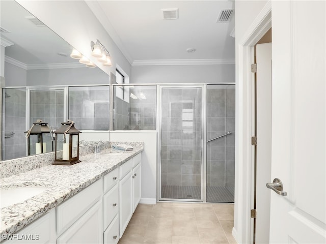 bathroom featuring crown molding, tile patterned flooring, vanity, and an enclosed shower