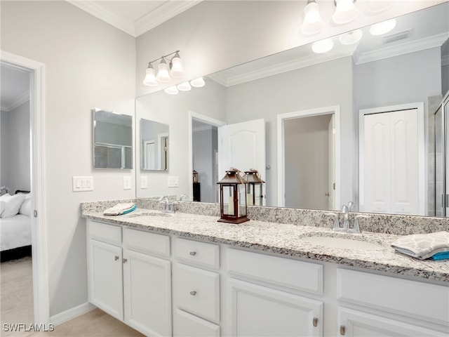 bathroom with tile patterned flooring, vanity, a shower with shower door, and crown molding