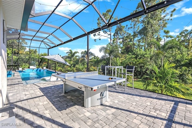 view of patio / terrace with a lanai