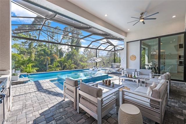 view of patio / terrace with a pool with hot tub, outdoor lounge area, ceiling fan, and glass enclosure