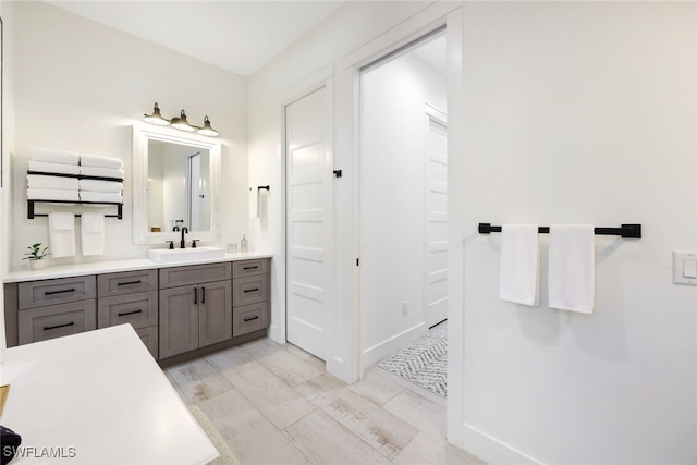 bathroom featuring vanity and hardwood / wood-style flooring