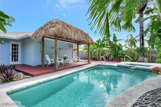 view of swimming pool with an in ground hot tub, a gazebo, and a deck