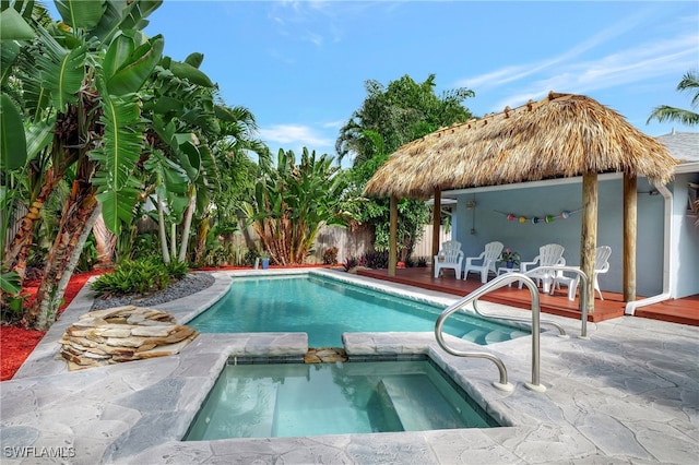 view of pool featuring a gazebo, an in ground hot tub, and a patio