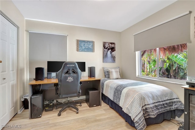 bedroom featuring a closet and light hardwood / wood-style floors