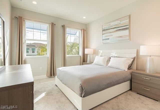 bedroom featuring light colored carpet