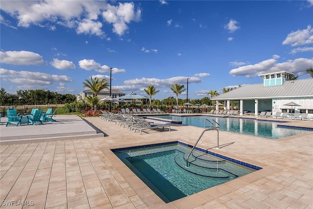 view of swimming pool featuring a patio area