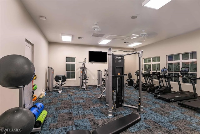 exercise room featuring dark colored carpet