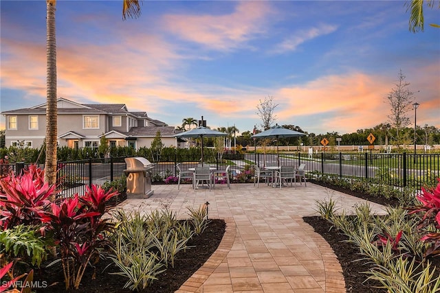 view of property's community with a patio