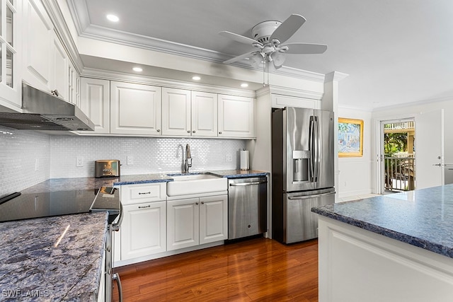 kitchen featuring appliances with stainless steel finishes, dark hardwood / wood-style floors, and white cabinetry