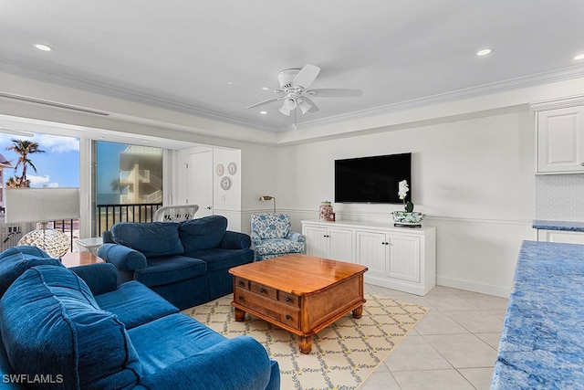 tiled living room with crown molding and ceiling fan