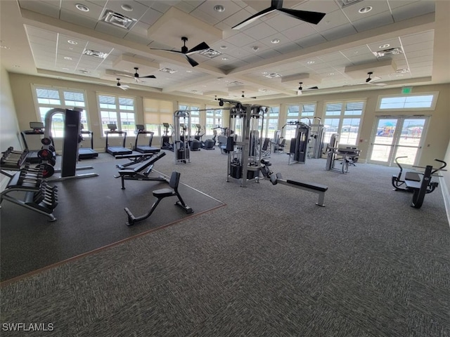 gym featuring ceiling fan and carpet floors