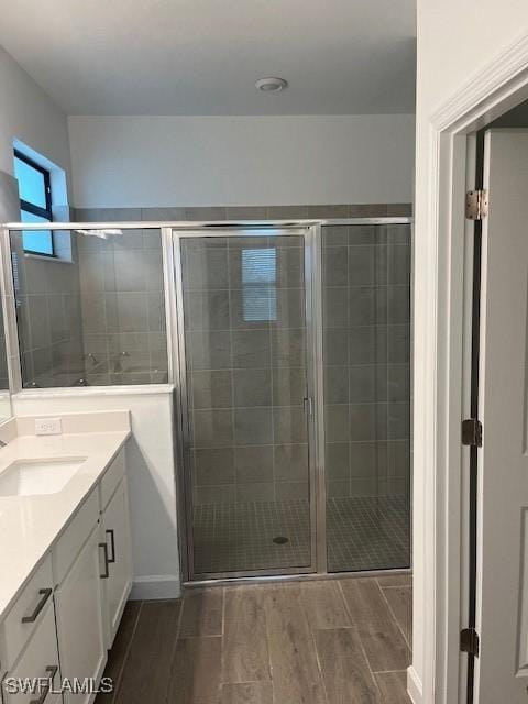 bathroom with vanity and an enclosed shower