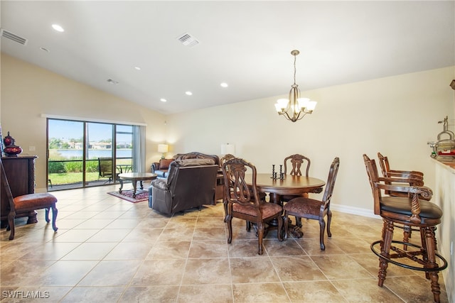 tiled dining space featuring a notable chandelier and vaulted ceiling