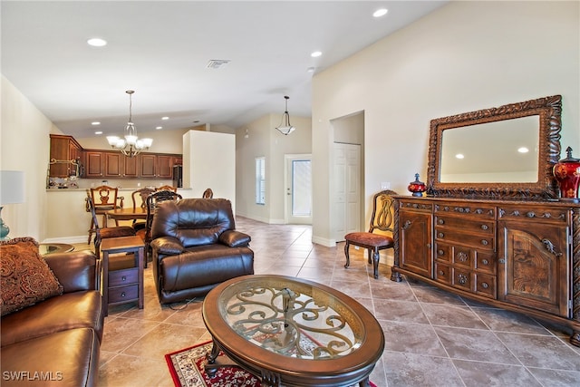 tiled living room with a notable chandelier and high vaulted ceiling