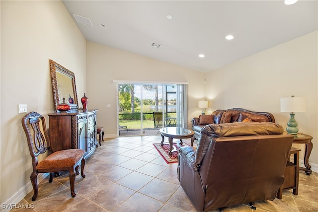 tiled living room featuring lofted ceiling