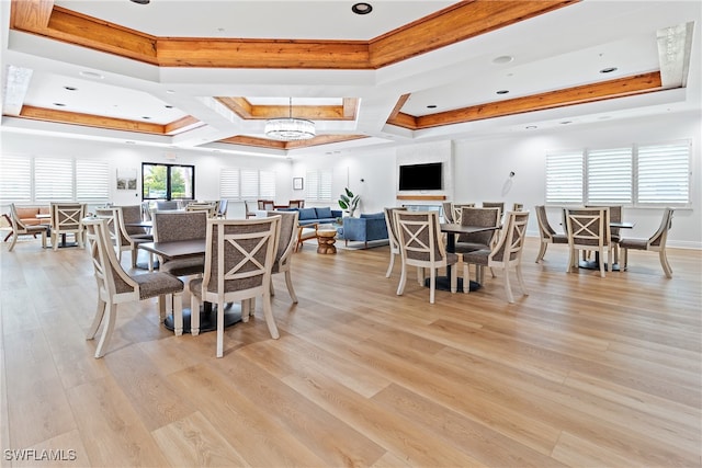 dining room with a notable chandelier, coffered ceiling, beam ceiling, and light hardwood / wood-style flooring