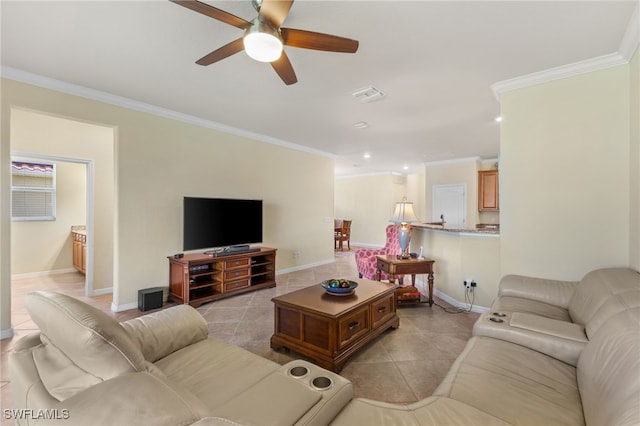 tiled living room featuring ornamental molding and ceiling fan