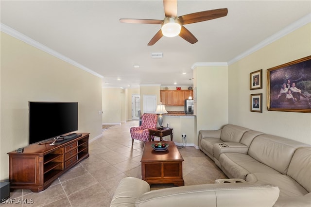 living room with ceiling fan, light tile patterned flooring, and crown molding