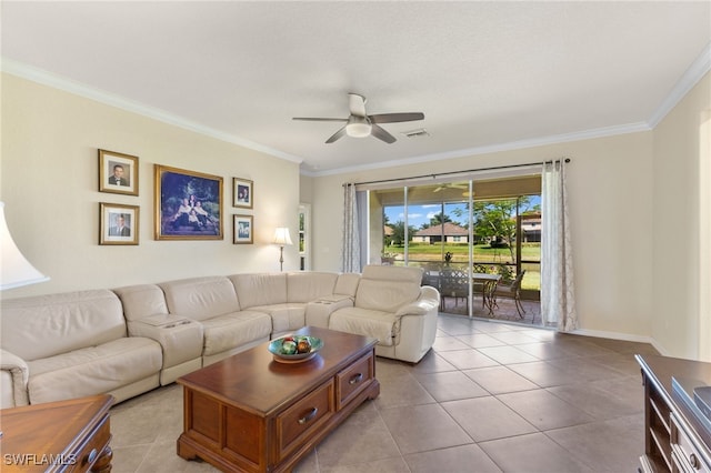 living room featuring ceiling fan, crown molding, and light tile patterned floors