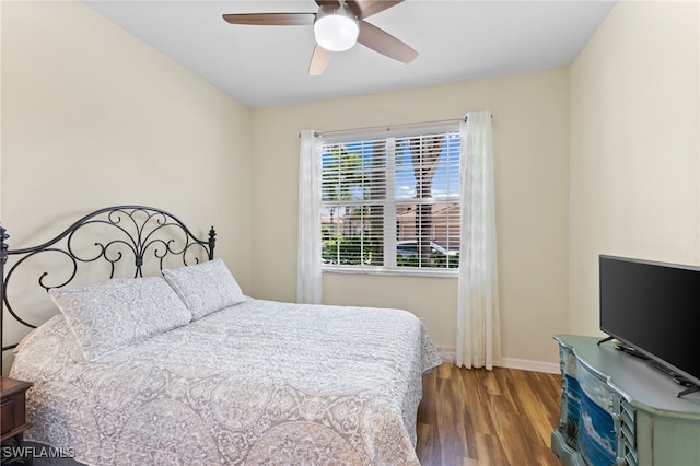 bedroom with wood-type flooring and ceiling fan