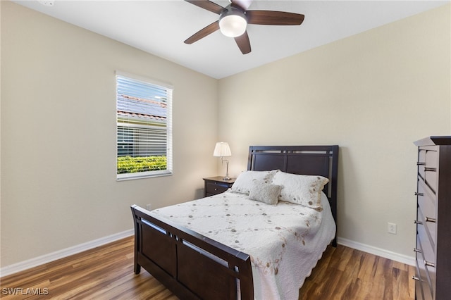 bedroom featuring dark wood-type flooring and ceiling fan