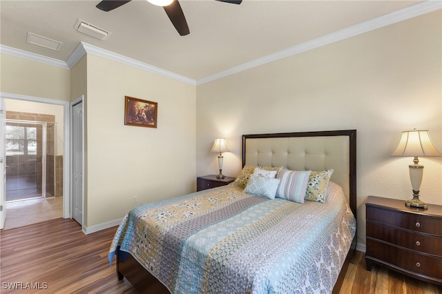 bedroom featuring ceiling fan, a closet, crown molding, and hardwood / wood-style floors