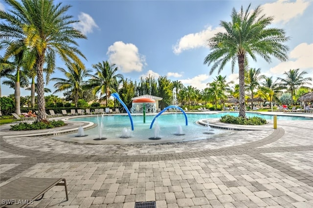 view of swimming pool with a patio area and pool water feature