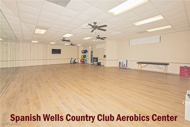 misc room featuring ceiling fan, hardwood / wood-style flooring, and a paneled ceiling