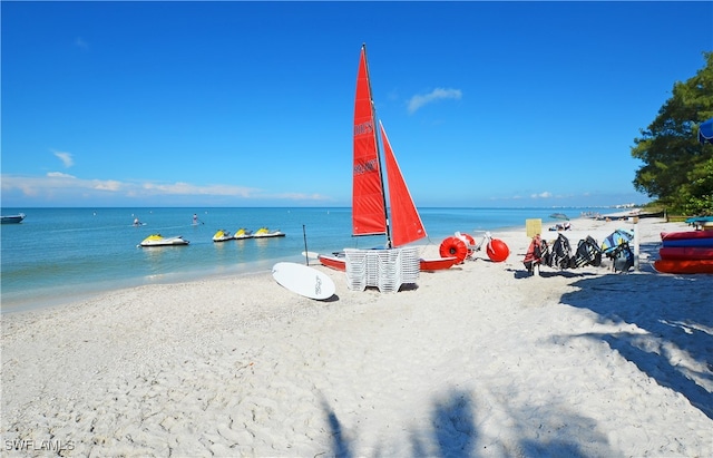 property view of water featuring a beach view