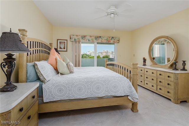 bedroom featuring ceiling fan and access to exterior