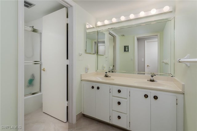 1036 S Collier Blvd Unit B-301, Marco Island, FL 34145 - full bath with double vanity, combined bath / shower with glass door, and tile patterned flooring