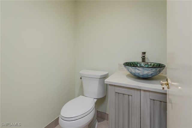 1036 S Collier Blvd Unit B-301, Marco Island, FL 34145 - bathroom featuring vanity, toilet, and baseboards