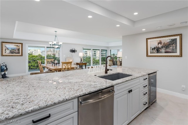 1036 S Collier Blvd Unit B-301, Marco Island, FL 34145 - kitchen featuring a sink, stainless steel dishwasher, recessed lighting, baseboards, and light stone countertops