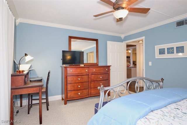 carpeted bedroom with ornamental molding and ceiling fan