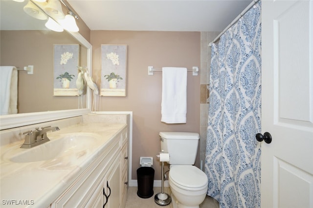 bathroom with vanity, tile patterned flooring, toilet, and curtained shower