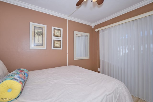bedroom featuring crown molding and ceiling fan