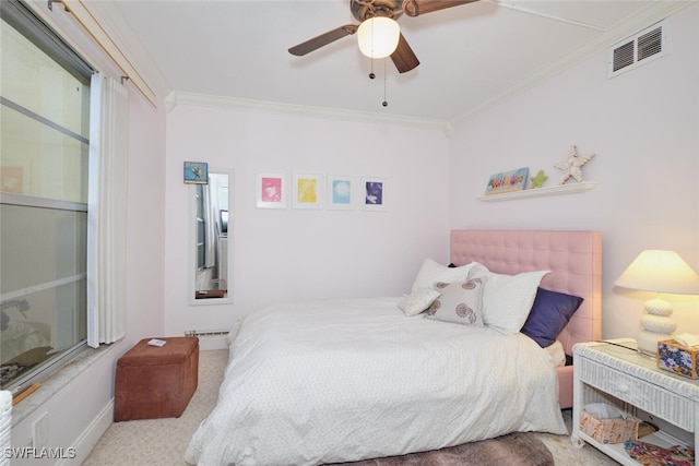 carpeted bedroom featuring ornamental molding, a baseboard heating unit, ceiling fan, and visible vents