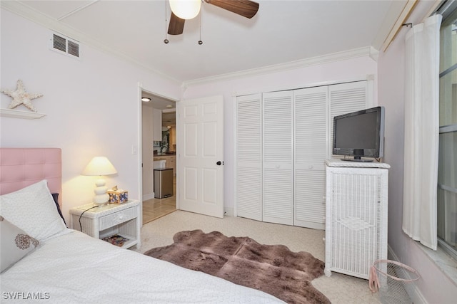 bedroom featuring visible vents, a closet, carpet, and ornamental molding