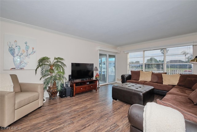 living room with ornamental molding and wood finished floors
