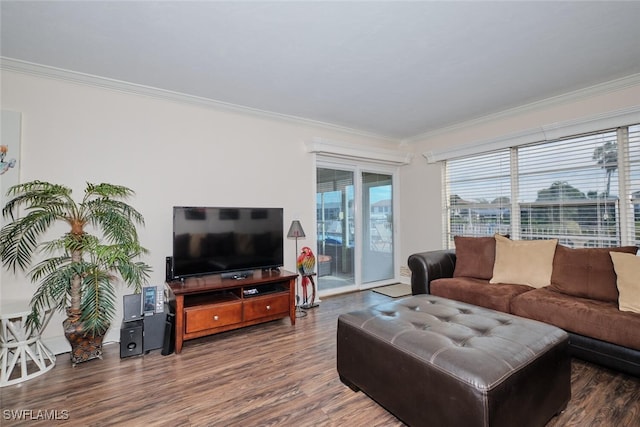 living area with ornamental molding and wood finished floors
